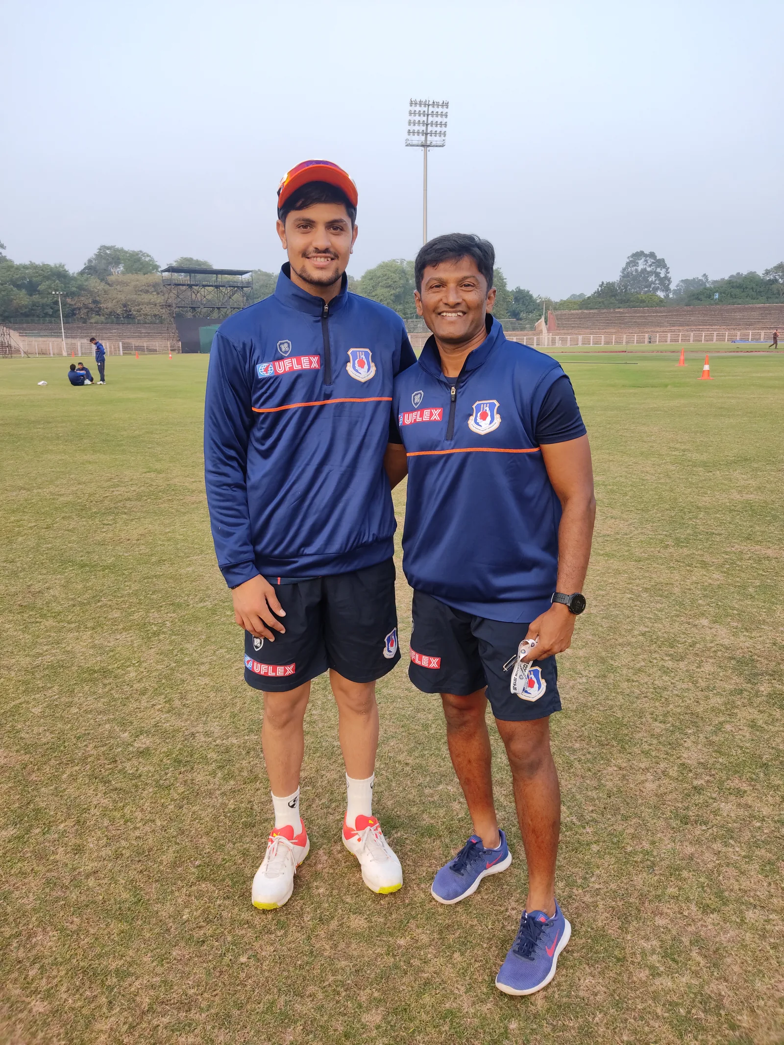 Sameer Rizvi, left, with Rashid Zirak at a cricket ground in December 2021